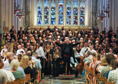 Sir John Rutter acknowledges the applause.